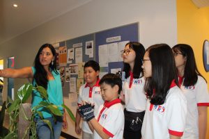 A teacher is guiding students