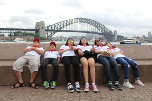 Students laying on a bench