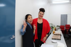 Two ladies are smiling