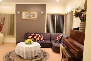 Living room has a piano